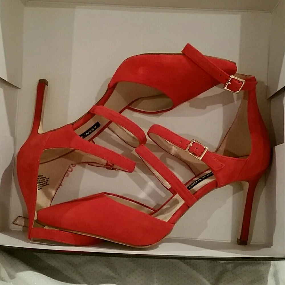 A pair of red suede pumps